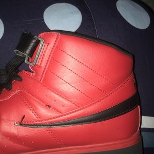 Red and black Fila shoes